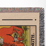 Close-up of a tarot card with 'Strength' text and colorful fringe at the edge.