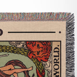 Close-up of a tarot card-style design on a textured surface with colorful fringe.